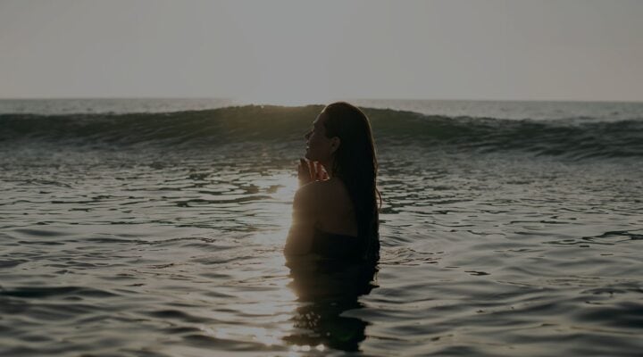 Welcome to the #BoySober Era 2 a woman happy in the ocean.